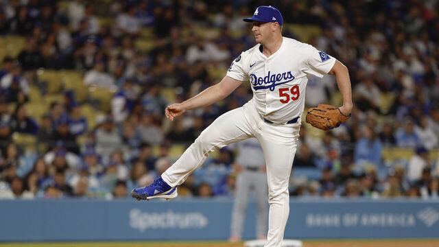 LOS ANGELES, CALIFORNIA - APRIL 28: Evan Phillips #59 of the Los Angeles Dodgers throws a pitch in the eighth inning during a game against the Miami Marlins at Dodger Stadium on April 28, 2025 in Los Angeles, California.
