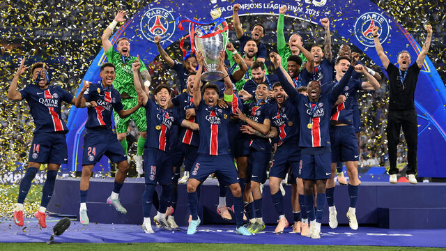 MUNICH, GERMANY - MAY 31: Marquinhos of Paris Saint-Germain lifts the UEFA Champions League trophy after his team's victory, to secure Paris Saint-Germain's first ever UEFA Champions League title in the club's history and a record UEFA Champions League Final winning scoreline of 5-0, following the UEFA Champions League Final 2025 between Paris Saint-Germain and FC Internazionale Milano at Munich Football Arena on May 31, 2025 in Munich, Germany.