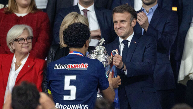 PARIS, FRANCE - May 24: Emmanuel Macron the President of France hands the winners trophy to Marquinhos #5 of Paris Saint-Germain during presentations after the PSG cup victory during the Paris Saint-Germain V Stade de Reims, Coupe de France Final at the Stade de France on May 24th 2025 in Paris, France