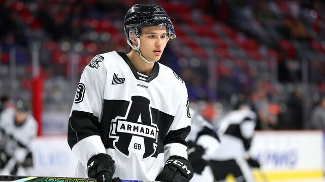 MONCTON, CANADA - MARCH 01: Justin Carbonneau #8 of the Blainville-Boisbriand Armada passes the puck before the game against the Moncton Wildcats at Avenir Centre on March 1, 2025 in Moncton, Canada.
