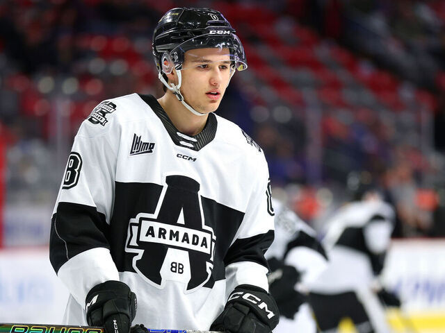 MONCTON, CANADA - MARCH 01: Justin Carbonneau #8 of the Blainville-Boisbriand Armada passes the puck before the game against the Moncton Wildcats at Avenir Centre on March 1, 2025 in Moncton, Canada.