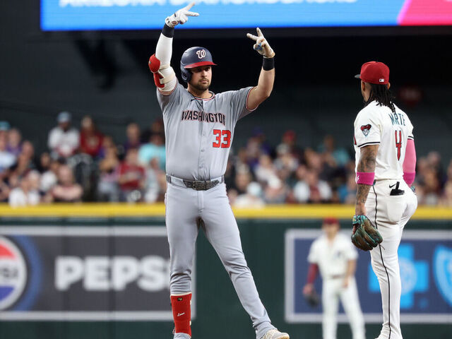 PHOENIX, ARIZONA - MAY 31: Nathaniel Lowe #33 of the Washington Nationals reacts after hitting an RBI double during the first inning against the Arizona Diamondbacks at Chase Field on May 31, 2025 in Phoenix, Arizona.