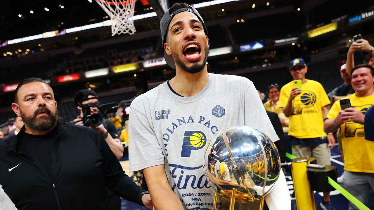 INDIANAPOLIS, INDIANA - MAY 31: Tyrese Haliburton #0 of the Indiana Pacers celebrates with the Bob Cousy Trophy after the 125-108 win against the New York Knicks in Game Six of the Eastern Conference Finals of the 2025 NBA Playoffs at Gainbridge Fieldhouse on May 31, 2025 in Indianapolis, Indiana.