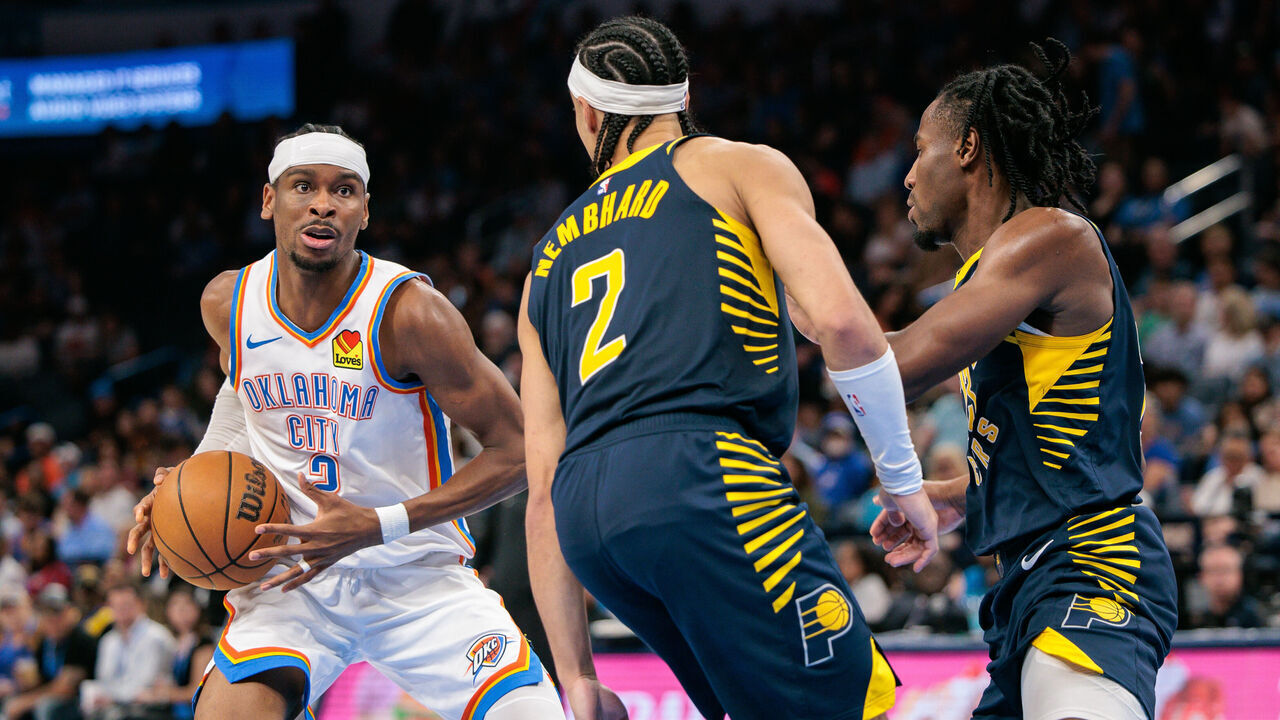 OKLAHOMA CITY, OKLAHOMA - MARCH 29: Shai Gilgeous-Alexander #2 of the Oklahoma City Thunder drives around Andrew Nembhard #2 of the Indiana Pacers during the third quarter at Paycom Center on March 29, 2025 in Oklahoma City, Oklahoma.