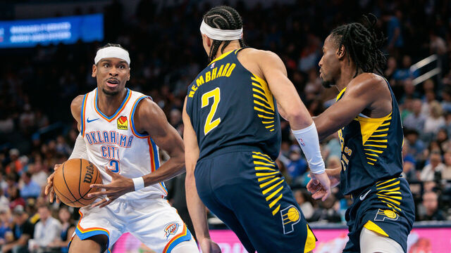 OKLAHOMA CITY, OKLAHOMA - MARCH 29: Shai Gilgeous-Alexander #2 of the Oklahoma City Thunder drives around Andrew Nembhard #2 of the Indiana Pacers during the third quarter at Paycom Center on March 29, 2025 in Oklahoma City, Oklahoma.