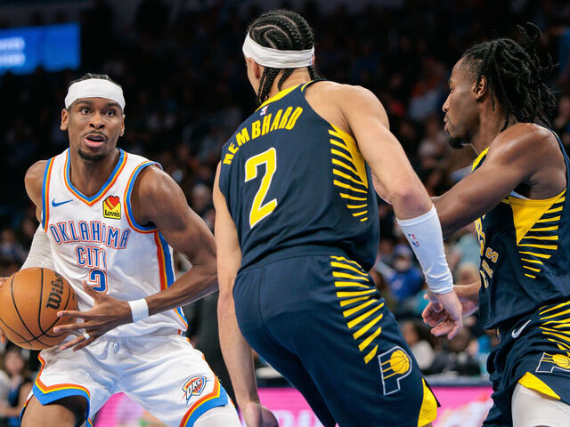 OKLAHOMA CITY, OKLAHOMA - MARCH 29: Shai Gilgeous-Alexander #2 of the Oklahoma City Thunder drives around Andrew Nembhard #2 of the Indiana Pacers during the third quarter at Paycom Center on March 29, 2025 in Oklahoma City, Oklahoma.