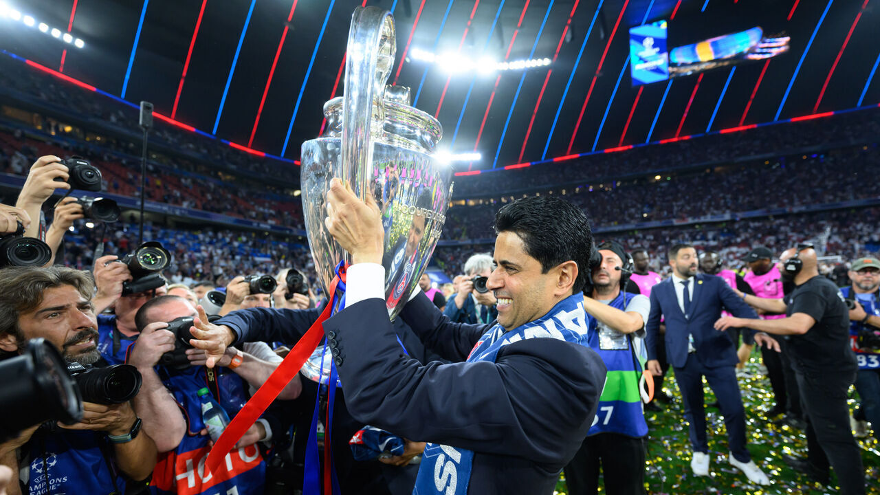31 May 2025, Bavaria, Munich: Soccer: Champions League, Paris Saint-Germain - Inter Milan, knockout round, final, Munich Football Arena. Nasser Al-Khelaifi, President of Paris Saint-Germain, holds the trophy after the match. Photo: Robert Michael/dpa