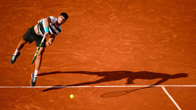 PARIS, FRANCE - JUNE 1: Carlos Alcaraz of Spain serves against Ben Shelton of United States during the Men's Singles Fourth Round match on Day Eight of the 2025 French Open at Roland Garros on June 01, 2025 in Paris, France.