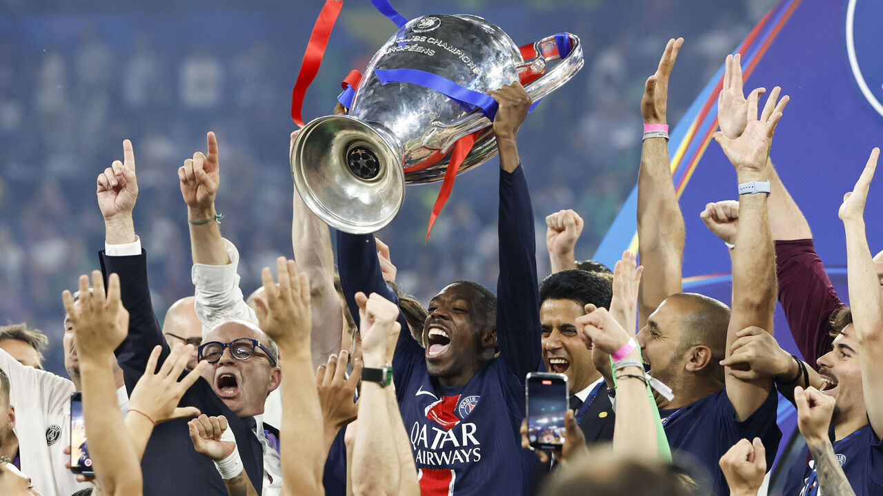 MUNICH, GERMANY - MAY 31: Ousmane Dembele of PSG, PSG President Nasser Al Khelaifi celebrate during the trophy ceremony following the UEFA Champions League Final 2025 between Paris Saint-Germain (PSG) and FC Internazionale Milano (Inter Milan) at Allianz Arena on May 31, 2025 in Munich, Germany.