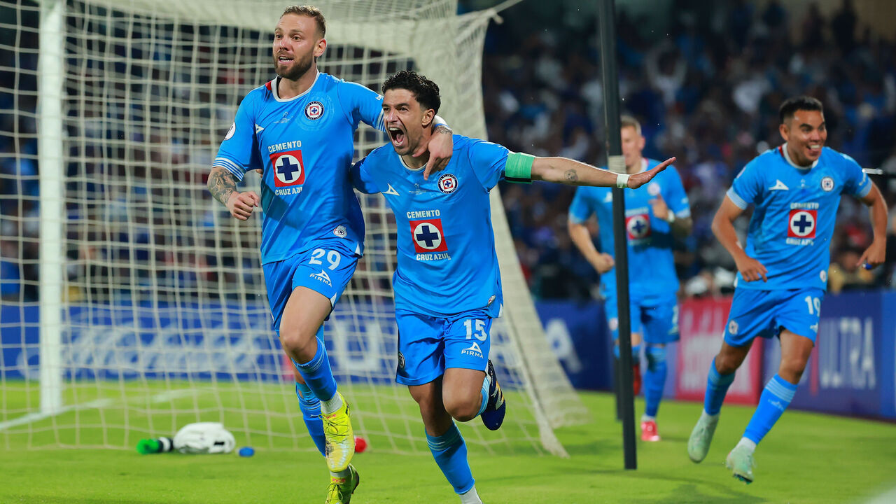 MEXICO CITY, MEXICO - JUNE 01: Ignacio Rivero of Cruz Azul celebrates with teammate Carlos Rotondi after scoring the team's first goal during the final match between Cruz Azul and Whitecaps as part of the CONCACAF Champions Cup 2025 at Estadio Olimpico Universitario on June 01, 2025 in Mexico City, Mexico.