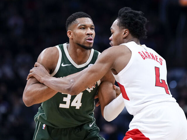 TORONTO, ON - JANUARY 6: Giannis Antetokounmpo #34 of the Milwaukee Bucks holds Scottie Barnes #4 of the Toronto Raptors at the Scotiabank Arena on January 6, 2025 in Toronto, Ontario, Canada. NOTE TO USER: User expressly acknowledges and agrees that, by downloading and/or using this Photograph, user is consenting to the terms and conditions of the Getty Images License Agreement.