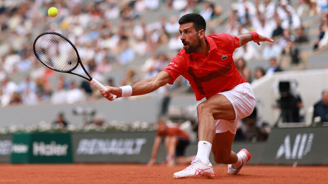 PARIS, FRANCE - JUNE 02: Novak Djokovic of Serbia plays a backhand against Cameron Norrie of Great Britain during the Men's Singles Fourth Round match on Day Nine of the 2025 French Open at Roland Garros on June 02, 2025 in Paris, France.