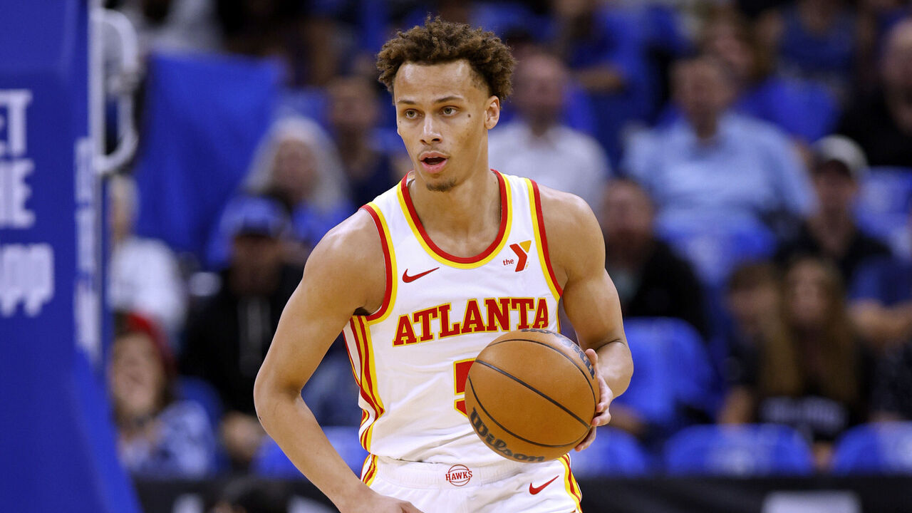 ORLANDO, FLORIDA - APRIL 15: Dyson Daniels #5 of the Atlanta Hawks brings the ball up the floor during the first half of an NBA play-in tournament game against the Orlando Magic at Kia Center on April 15, 2025 in Orlando, Florida.