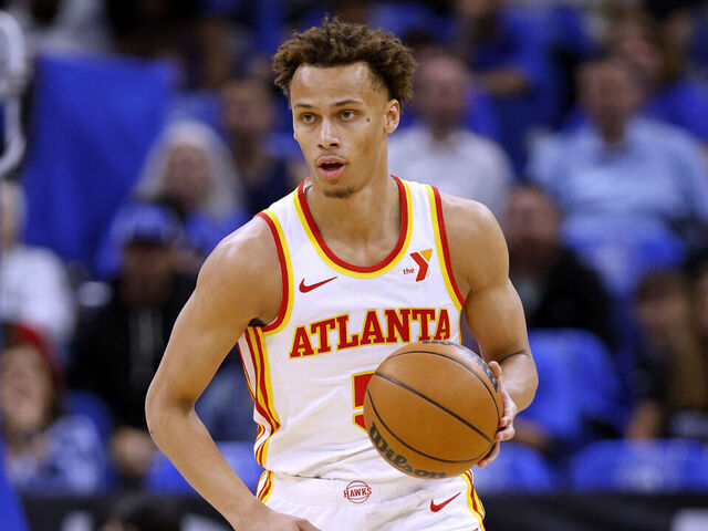 ORLANDO, FLORIDA - APRIL 15: Dyson Daniels #5 of the Atlanta Hawks brings the ball up the floor during the first half of an NBA play-in tournament game against the Orlando Magic at Kia Center on April 15, 2025 in Orlando, Florida.