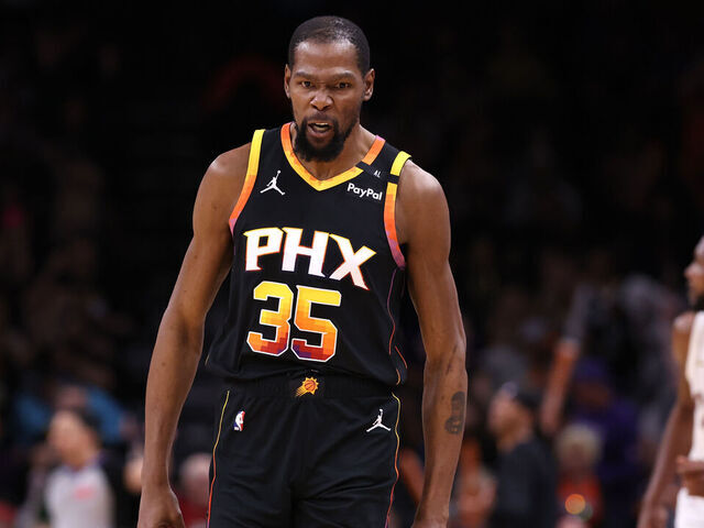 PHOENIX, ARIZONA - MARCH 21: Kevin Durant #35 of the Phoenix Suns reacts after hitting a three point basket during the second half against the Cleveland Cavaliers at PHX Arena on March 21, 2025 in Phoenix, Arizona.