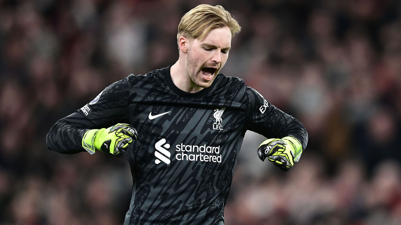 LIVERPOOL, ENGLAND - APRIL 2: Liverpool's Caoimhin Kelleher celebrates at the final whistle during the Premier League match between Liverpool FC and Everton FC at Anfield on April 2, 2025 in Liverpool, England.