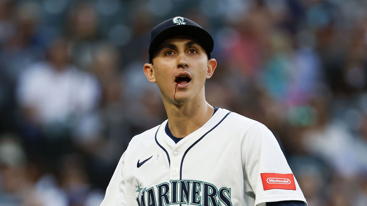 SEATTLE, WASHINGTON - JUNE 03: George Kirby #68 of the Seattle Mariners reacts after taking a ball to the face during the fifth inning against the Baltimore Orioles at T-Mobile Park on June 03, 2025 in Seattle, Washington.
