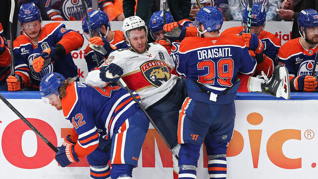 EDMONTON, CANADA - JUNE 04: Kasperi Kapanen #42 and Leon Draisaitl #29 of the Edmonton Oilers collide with Carter Verhaeghe #23 of the Florida Panthers during the second period in Game One of the 2025 Stanley Cup Final at Rogers Place on June 04, 2025 in Edmonton, Alberta, Canada.
