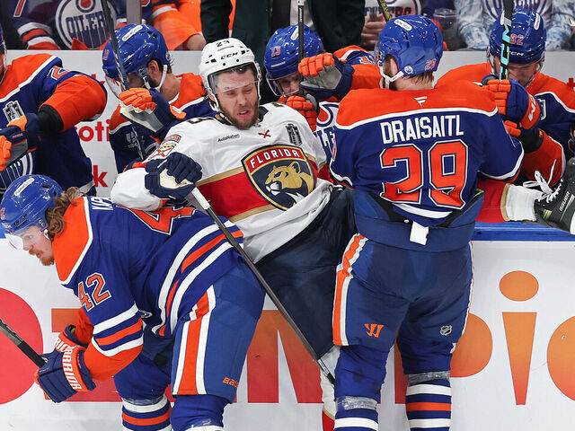EDMONTON, CANADA - JUNE 04: Kasperi Kapanen #42 and Leon Draisaitl #29 of the Edmonton Oilers collide with Carter Verhaeghe #23 of the Florida Panthers during the second period in Game One of the 2025 Stanley Cup Final at Rogers Place on June 04, 2025 in Edmonton, Alberta, Canada.