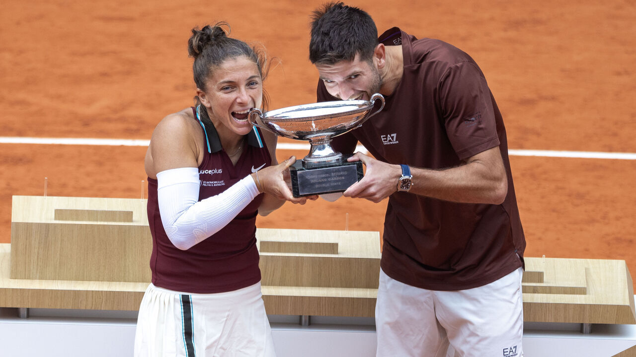 PARIS, FRANCE - JUNE 5: Sara Errani and Andrea Vavassori of Italy celebrate with the winners trophy after their victory against Taylor Townsend and Evan King of the United States in the Mixed Doubles Final on Court Philippe-Chatrier during the 2025 French Open Tennis Tournament at Roland Garros on June 5th, 2025, in Paris, France.