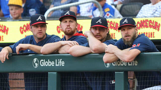 ATLANTA, GA - JUNE 03: Braves pitchers Bryce Elder (l), Spencer Schwellenbach, Grant Holmes and Chris Sale (r) watch from the top of the dugout during the Tuesday evening MLB game between the Atlanta Braves and the Arizona Diamondbacks on June 3, 2025 at Truist Park in Atlanta, Georgia.