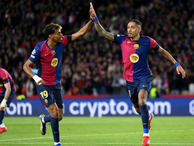 BARCELONA, SPAIN - MARCH 11: Raphinha of FC Barcelona celebrates scoring his team's third goal with teammate Lamine Yamal during the UEFA Champions League 2024/25 UEFA Champions League 2024/25 Round of 16 Second Leg match between FC Barcelona and SL Benfica at Estadi Olímpic Lluís Companys on March 11, 2025 in Barcelona, Spain.