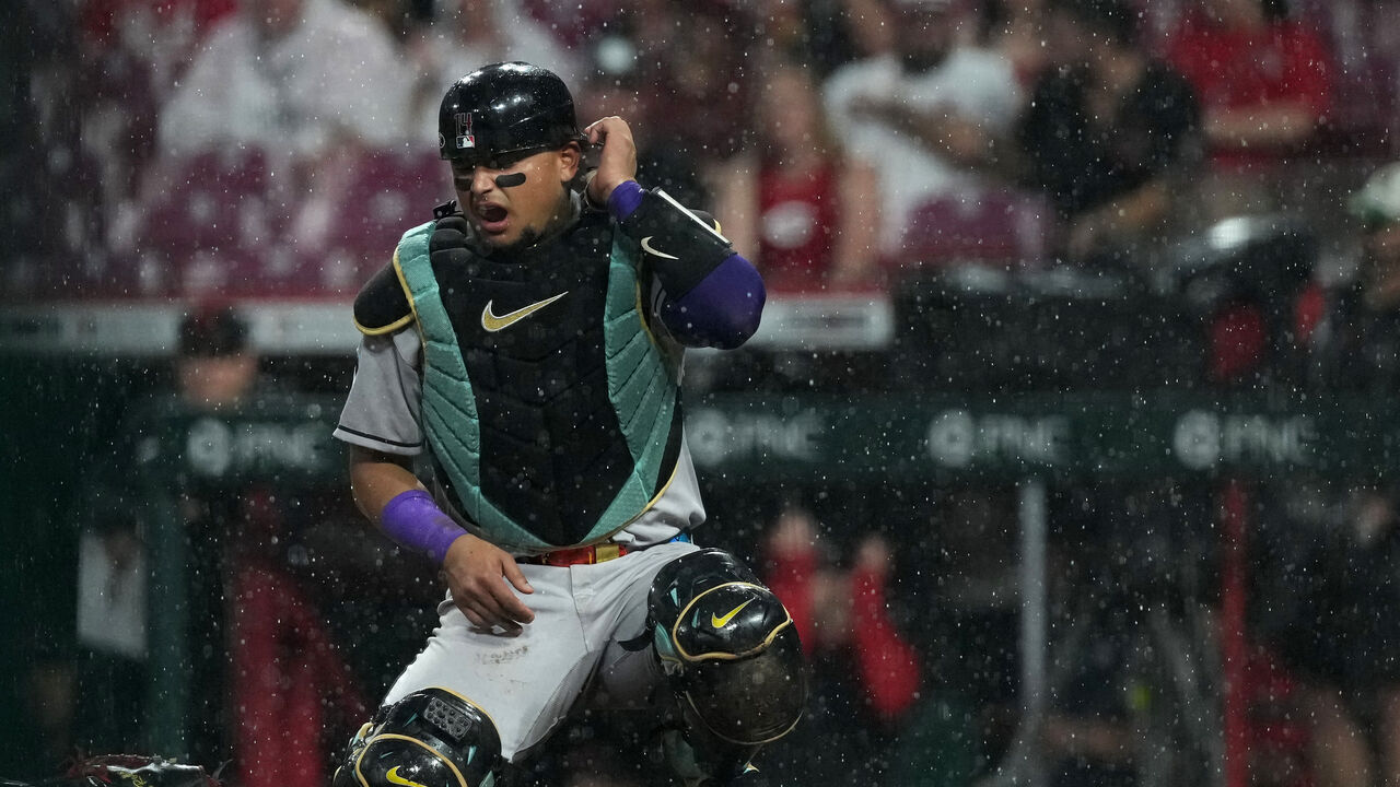 CINCINNATI, OHIO - JUNE 06: Gabriel Moreno #14 of the Arizona Diamondbacks reacts to being hit by a ball during the sixth inning against the Cincinnati Reds at Great American Ball Park on June 06, 2025 in Cincinnati, Ohio.