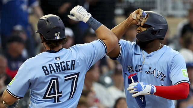 MINNEAPOLIS, MINNESOTA - JUNE 6: Addison Barger #47 of the Toronto Blue Jays celebrates his home run with Vladimir Guerrero Jr. #27 in the fourth inning against the Minnesota Twins at Target Field on June 6, 2025 in Minneapolis, Minnesota.