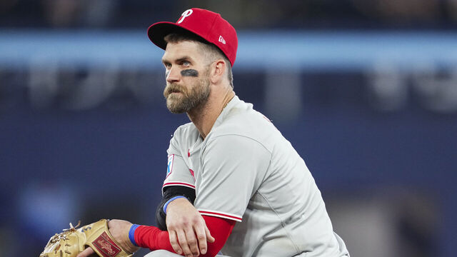 TORONTO, ON - JUNE 4: Bryce Harper #3 of the Philadelphia Phillies kneels in a break in play against the Toronto Blue Jays in their MLB game at the Rogers Centre on June 4, 2025 in Toronto, Ontario, Canada.