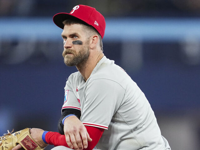 TORONTO, ON - JUNE 4: Bryce Harper #3 of the Philadelphia Phillies kneels in a break in play against the Toronto Blue Jays in their MLB game at the Rogers Centre on June 4, 2025 in Toronto, Ontario, Canada.