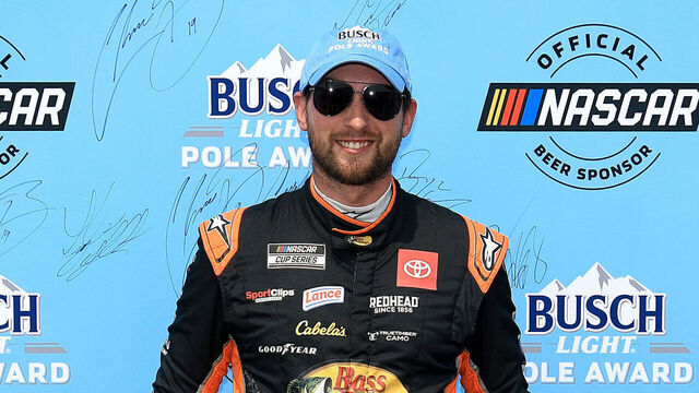 BROOKLYN, MICHIGAN - JUNE 07: Chase Briscoe, driver of the #19 Bass Pro Shops Toyota, poses for photos after winning the pole award during qualifying for the NASCAR Cup Series FireKeepers Casino 400 at Michigan International Speedway on June 07, 2025 in Brooklyn, Michigan.