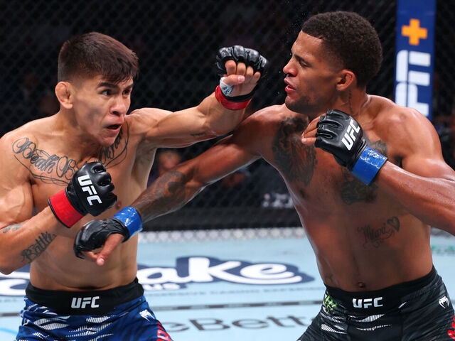 NEWARK, NEW JERSEY - JUNE 07: (L-R) Mario Bautista punches Patchy Mix in a bantamweight bout during the UFC 316 event at Prudential Center on June 07, 2025 in Newark, New Jersey.