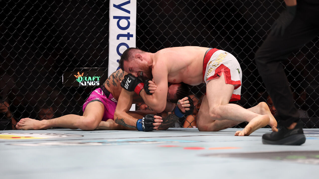 NEWARK, NEW JERSEY - JUNE 07: Merab Dvalishvili of Georgia holds down Sean O'Malley of the United States in the bantamweight title bout during UFC 316 at the Prudential Center on June 07, 2025 in Newark, New Jersey.