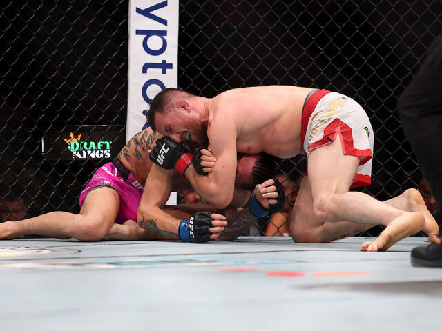 NEWARK, NEW JERSEY - JUNE 07: Merab Dvalishvili of Georgia holds down Sean O'Malley of the United States in the bantamweight title bout during UFC 316 at the Prudential Center on June 07, 2025 in Newark, New Jersey.
