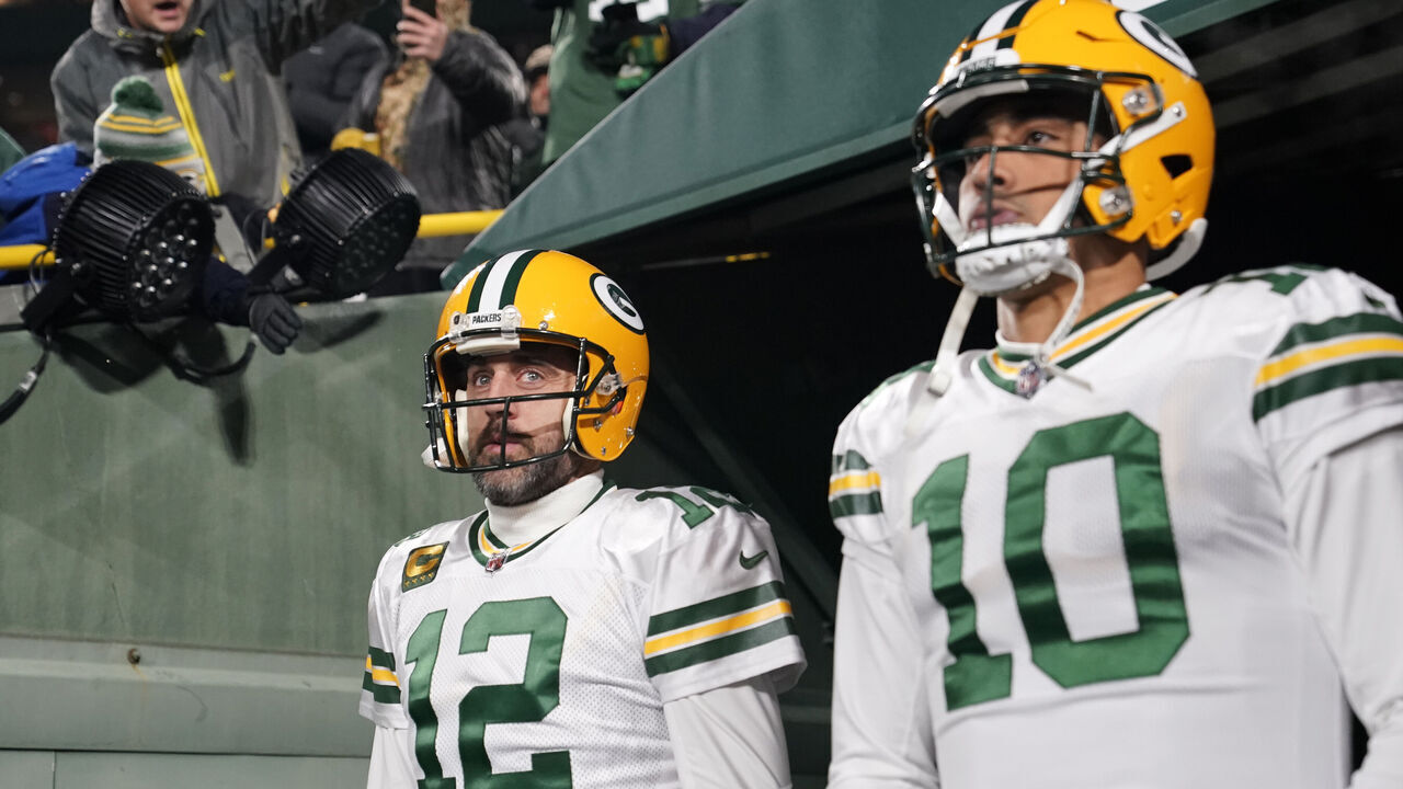 GREEN BAY, WISCONSIN - NOVEMBER 17: Aaron Rodgers #12 and Jordan Love #10 of the Green Bay Packers walk onto the field prior to the game against the Tennessee Titans at Lambeau Field on November 17, 2022 in Green Bay, Wisconsin.