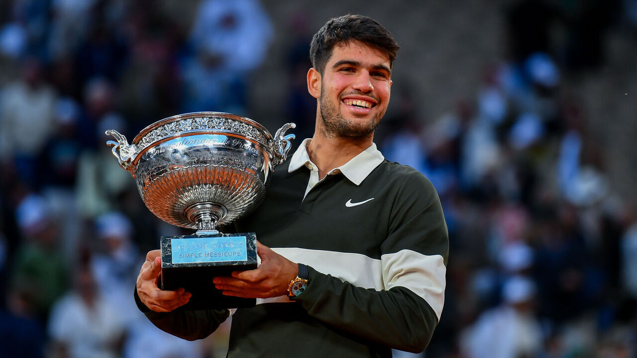 PARIS, FRANCE - JUNE 08: Carlos Alcaraz of Spain celebrates with the winners trophy after victory against Jannik Sinner of Italy during the Men’s Singles Final match on Day Fifteen of the 2025 French Open at Roland Garros on June 08, 2025 in Paris, France.