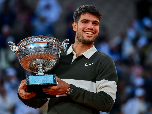 PARIS, FRANCE - JUNE 08: Carlos Alcaraz of Spain celebrates with the winners trophy after victory against Jannik Sinner of Italy during the Men’s Singles Final match on Day Fifteen of the 2025 French Open at Roland Garros on June 08, 2025 in Paris, France.