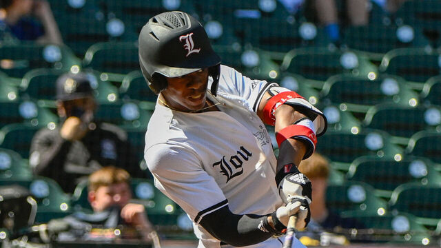 HOUSTON, TX - MARCH 05: Louisville outfielder Eddie King Jr. (42) hits a standup double during the baseball game between the Michigan Wolverines and Louisville Cardinals during the Shriners Children's College Classic at Minute Maid Park on March 5, 2023 in Houston, Texas.