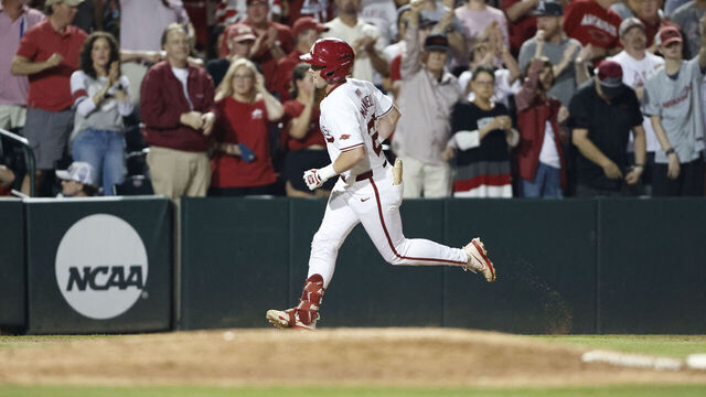 FAYETTEVILLE, AR - JUNE 01: Arkansas Razorbacks fans cheer after Arkansas Razorbacks outfielder Logan Maxwell (22) hit a home run during the NCAA Division I Regional baseball game between the Creighton Blue Jays and Arkansas Razorbacks on June 1, 2025, at Baum-Walker Stadium in Fayetteville, Arkansas.