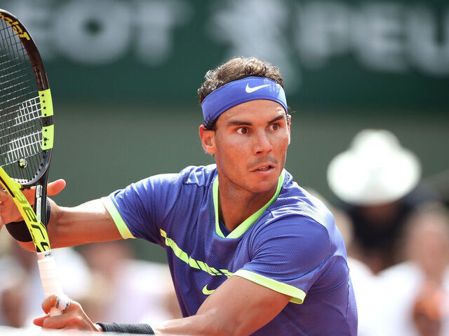 2017 French Open Tennis Tournament - Day Fifteen. Rafael Nadal of Spain in action against Stan Wawrinka of Switzerland in the Men's Singles Final match on Philippe-Chatrier Court at the 2017 French Open Tennis Tournament at Roland Garros on June 11th, 2017 in Paris, France.