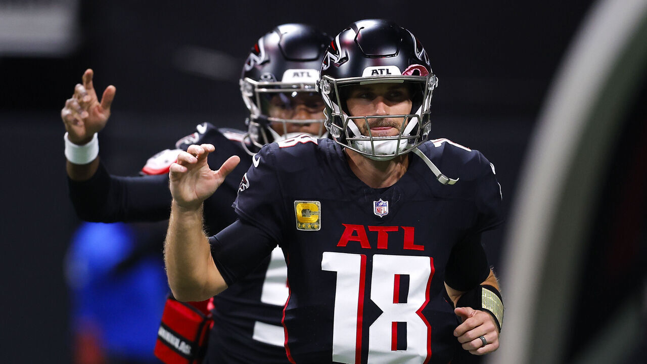 ATLANTA, GEORGIA - NOVEMBER 3: Kirk Cousins #18 and Michael Penix Jr. #9 of the Atlanta Falcons take the field to warm up prior to the game against the Dallas Cowboys at Mercedes-Benz Stadium on November 3, 2024 in Atlanta, Georgia.