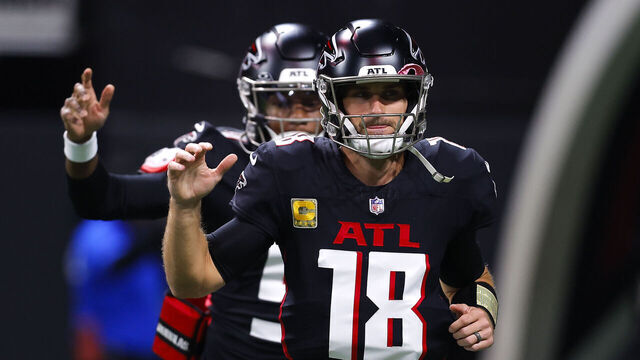 ATLANTA, GEORGIA - NOVEMBER 3: Kirk Cousins #18 and Michael Penix Jr. #9 of the Atlanta Falcons take the field to warm up prior to the game against the Dallas Cowboys at Mercedes-Benz Stadium on November 3, 2024 in Atlanta, Georgia.