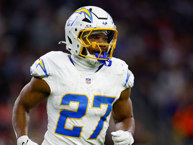 HOUSTON, TEXAS - JANUARY 11: J.K. Dobbins #27 of the Los Angeles Chargers walks between plays during the second half of the AFC Wild Card Playoff game against the Houston Texans at NRG Stadium on January 11, 2025 in Houston, Texas.