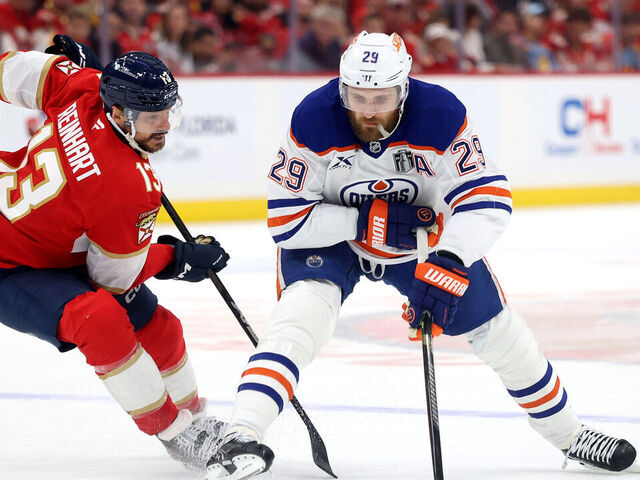 SUNRISE, FLORIDA - JUNE 09: Sam Reinhart #13 of the Florida Panthers defends Leon Draisaitl #29 of the Edmonton Oilers during the first period in Game Three of the 2025 Stanley Cup Final at Amerant Bank Arena on June 09, 2025 in Sunrise, Florida.