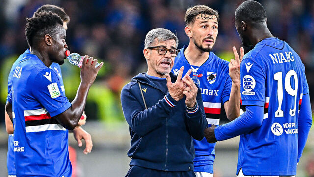 GENOA, ITALY - MAY 9: Alberico Evani, head coach of Sampdoria (center), issues Rémi Oudin and M'Baye Niang some instructions during the Serie B match between UC Sampdoria and US Salernitana 1919 at Stadio Luigi Ferraris on May 9, 2025 in Genoa, Italy.