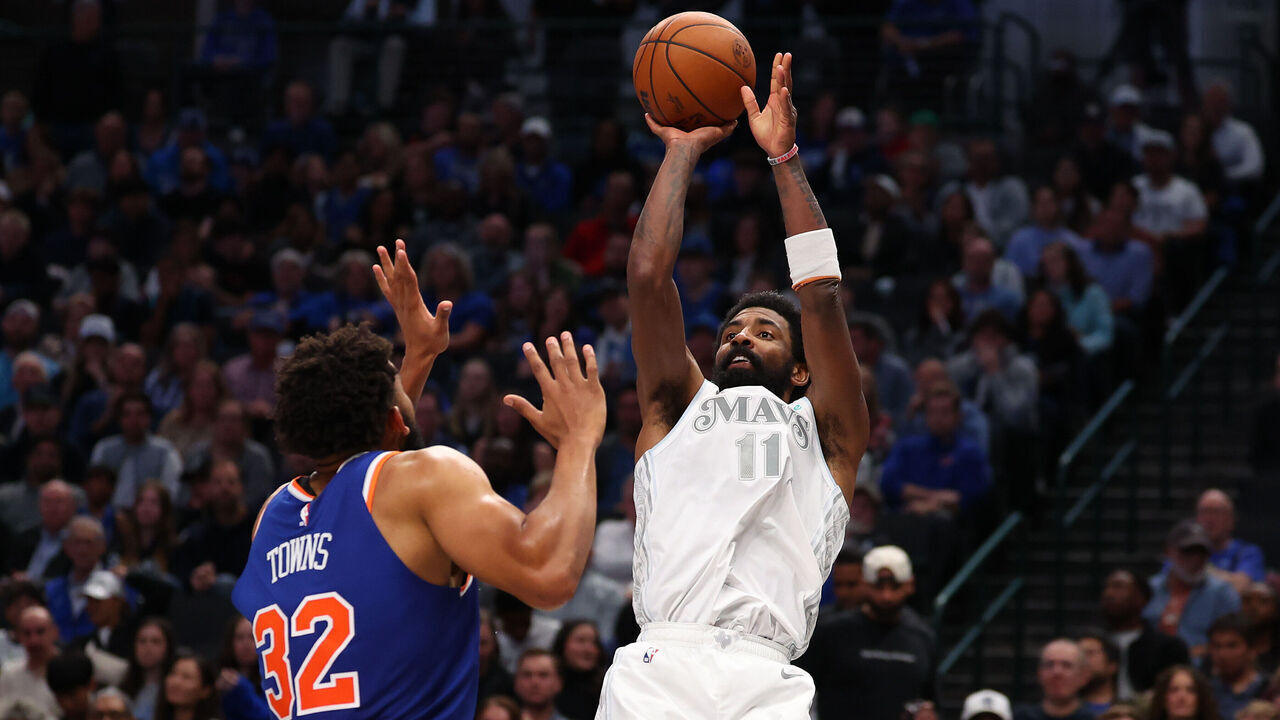 DALLAS, TEXAS - NOVEMBER 27: Kyrie Irving #11 of the Dallas Mavericks shoots over Karl-Anthony Towns #32 of the New York Knicks during the second half at American Airlines Center on November 27, 2024 in Dallas, Texas. NOTE TO USER: User expressly acknowledges and agrees that, by downloading and/or using this photograph, user is consenting to the terms and conditions of the Getty Images License Agreement.