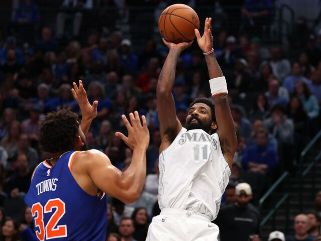 DALLAS, TEXAS - NOVEMBER 27: Kyrie Irving #11 of the Dallas Mavericks shoots over Karl-Anthony Towns #32 of the New York Knicks during the second half at American Airlines Center on November 27, 2024 in Dallas, Texas. NOTE TO USER: User expressly acknowledges and agrees that, by downloading and/or using this photograph, user is consenting to the terms and conditions of the Getty Images License Agreement.