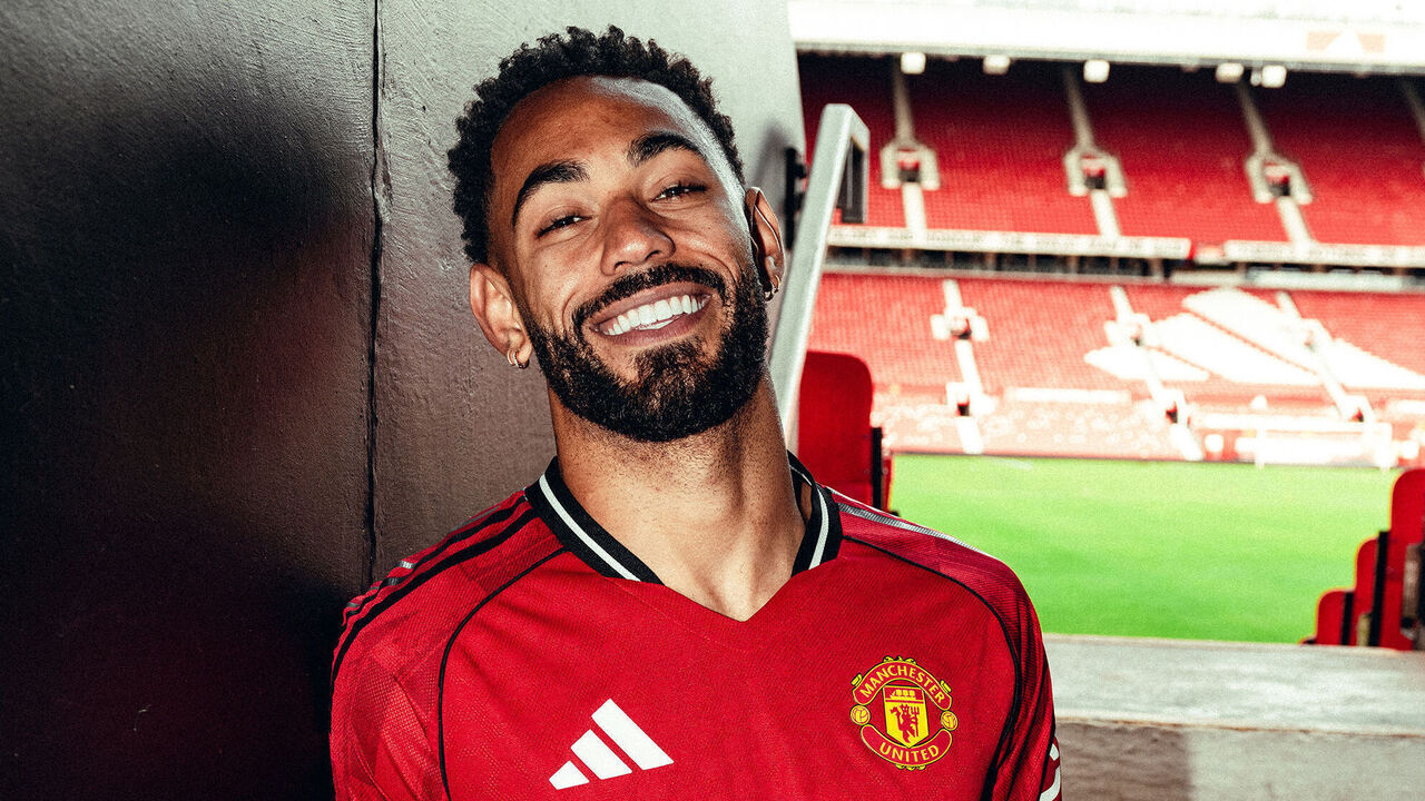 MANCHESTER, ENGLAND - JUNE 12: (EXCLUSIVE COVERAGE) Matheus Cunha of Manchester United poses for a photo after signing his contract with the club at Old Trafford on June 12, 2025 in Manchester, England.