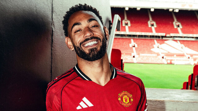 MANCHESTER, ENGLAND - JUNE 12: (EXCLUSIVE COVERAGE) Matheus Cunha of Manchester United poses for a photo after signing his contract with the club at Old Trafford on June 12, 2025 in Manchester, England.