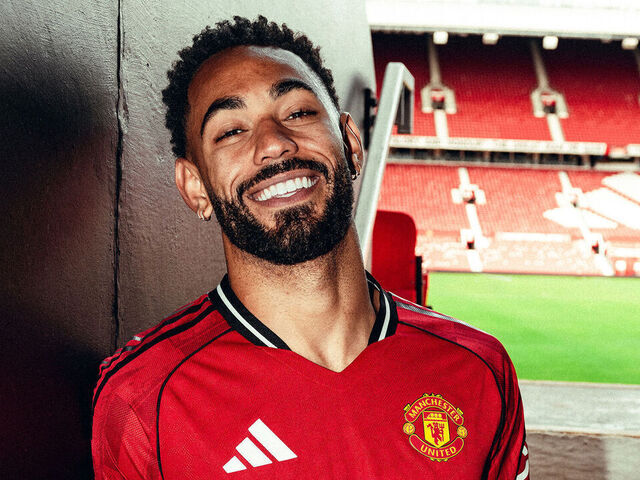 MANCHESTER, ENGLAND - JUNE 12: (EXCLUSIVE COVERAGE) Matheus Cunha of Manchester United poses for a photo after signing his contract with the club at Old Trafford on June 12, 2025 in Manchester, England.